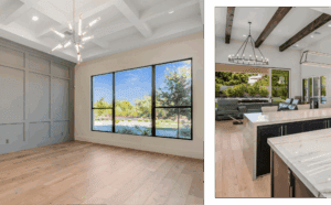 Custom home with modern luxury living room with floor-to-ceiling windows, vaulted white ceilings with exposed beams, and a view of the Arizona desert landscape