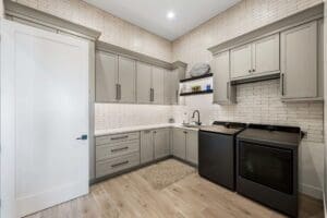 Luxury laundry room with custom cabinetry and storage in Queen Creek Arizona