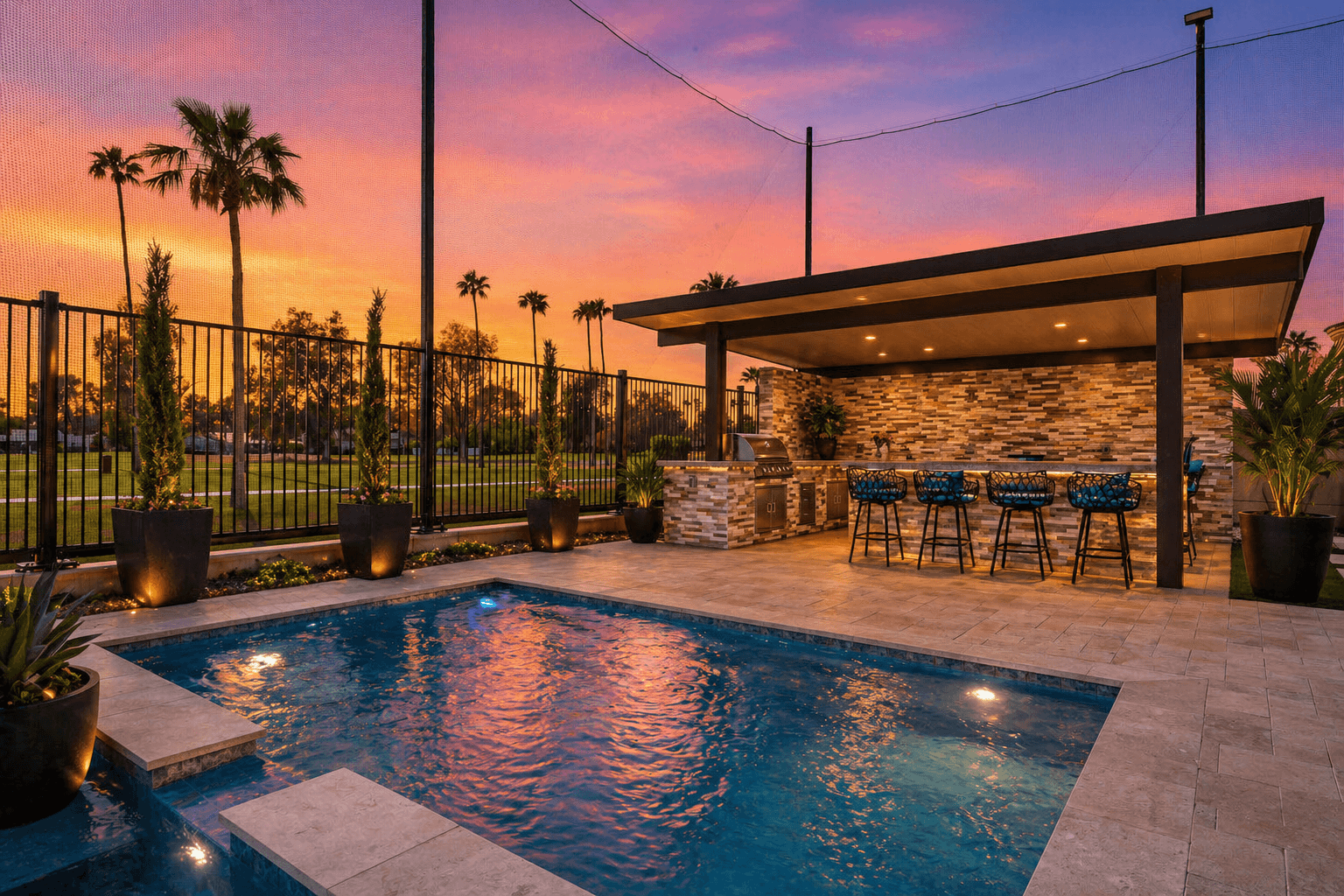 Luxury custom home kitchen in Queen Creek Arizona featuring a large quartz waterfall island, open concept layout, and indoor outdoor living design