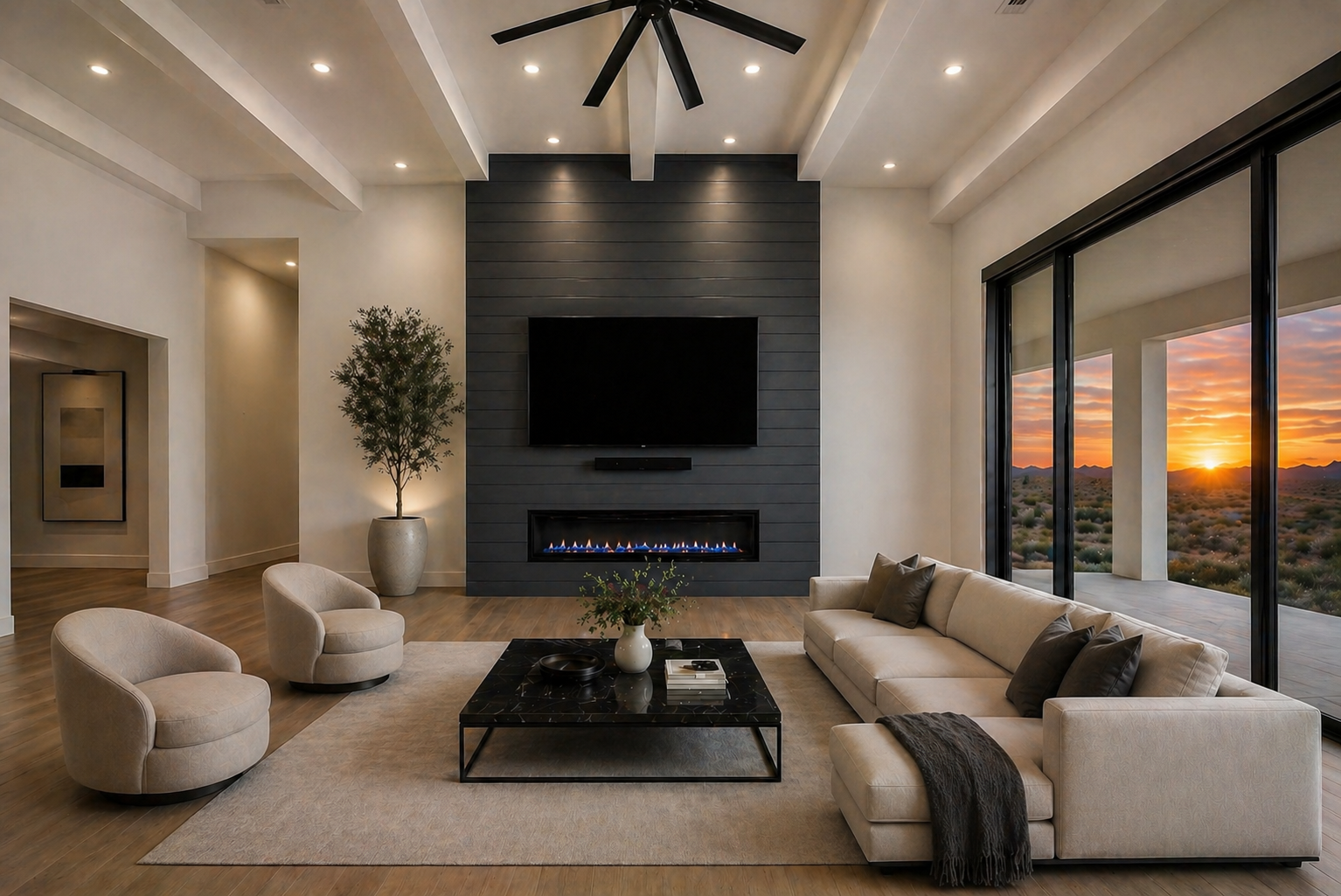 Luxury custom home kitchen in Queen Creek Arizona featuring a large quartz waterfall island, open concept layout, and indoor outdoor living design