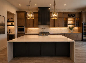 Luxury custom kitchen build with a large stone island, dark wood cabinetry, and warm under-cabinet lighting.